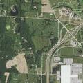 Dump truck spilling dirt and gravel on Highway 54