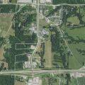 Pedestrian walking near city limits toward motel