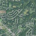 Person experiencing back pain near West Main Street, Speedway