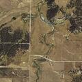 Wildland fire threatening a residence near Evan Road