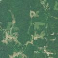 Fire and weapons reported near oil tanks at campsite