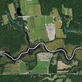 Brush fire spreading in field near campground