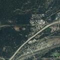 Grass fire with smoldering piles at High and Spring
