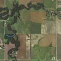 Tractor hits power pole, driver trapped by power line