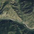 Broken-down SUV with flat tire and children at Grizzly Creek Rest Area