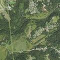Downed power line causing brush fire in woods