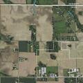 Man walking barefoot in roadway near church