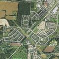 Person looking into homes on Flintlock Drive