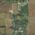 Unattended brush fire near railroad tracks in field