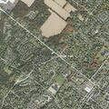 Person experiencing abdominal pain near Main Street