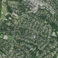 Elderly woman holding infant in rain at Hillside Ave