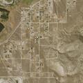 Person stealing dirt with backhoe and dump trailer