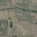 Caller reports neighbors shooting at rural address