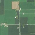 Brush fire spreading near tree line in Fort Jennings