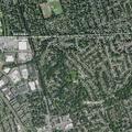 Downed trees block roadway and damage house