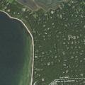 Leaning tree threatens roadway near Sunwood home