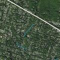 Illegal dumping by dump truck in wooded area