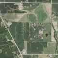 Unoccupied vehicle on fire in pasture near Milan