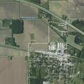 Cow loose on roadway near Farm Fertilizer