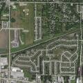 Person experiencing neck pain at residence on Rockwell Lane