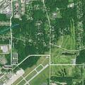 Tree blocking westbound lane near county airport