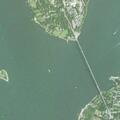 Pedestrian walking bicycle on Mt Hope Bridge