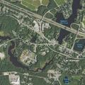 Suspicious person standing in roadway near office park