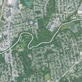 Cars blocking driveway near possible baseball game