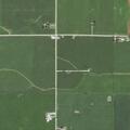 Person running near dark SUV at rural address