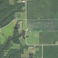 Suspicious person walking on rural gravel road