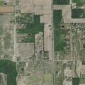 Person trapped upside down under lawnmower in ditch