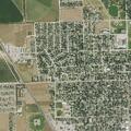 Man looking into parked cars near Platte Avenue