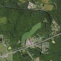 Female with abdominal pain reported near Wooded Estates Trailer Park