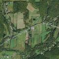 Woman pinned by tree on lawn tractor in Spencer woods