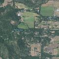 Tractor operating in dry grass near Williams Highway