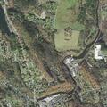 Police search woods and river area for male suspect