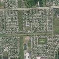 Speeding blue Honda sedan in subdivision