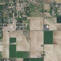 Water spraying onto roadway from irrigation pivot