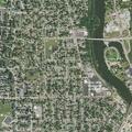 Caller reports gray car circling residence after prior threats