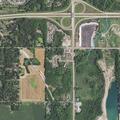Person walking in field near woods reported