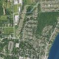 Person lying on front lawn near Baird Street in St. Clair