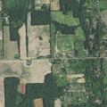 Grass fire spreading in field near homes in Durand