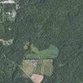 Suspicious pickup driving through fields and woods