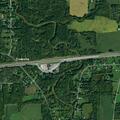 Erratic high-speed sedan nearly hits tractor trailer