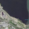 Semi trucks collide at industrial loading dock