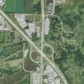Car hits deer on highway shoulder