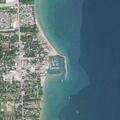 Elderly woman wades into water at Lexington beach