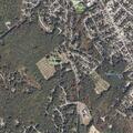 Car crash in woods behind local school, driver fled
