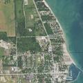 Report of suspicious people in woods near Huron Street