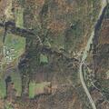 Elderly woman fallen with possible leg injury near County Road